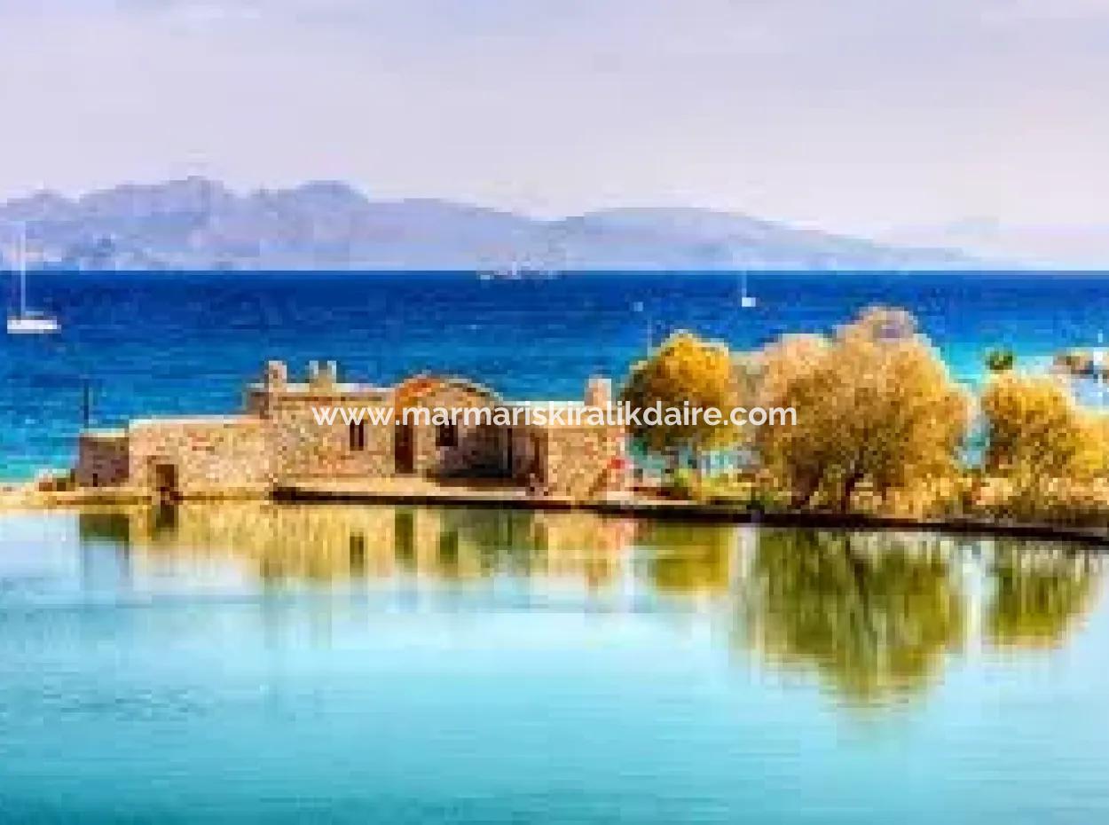 Datça İlçesi Kızlan Mevkisinde Denize Sıfır 10000M2 Turizm İmarlı Denize Sıfır Otel Yapımına Uygun Satılık Arsa